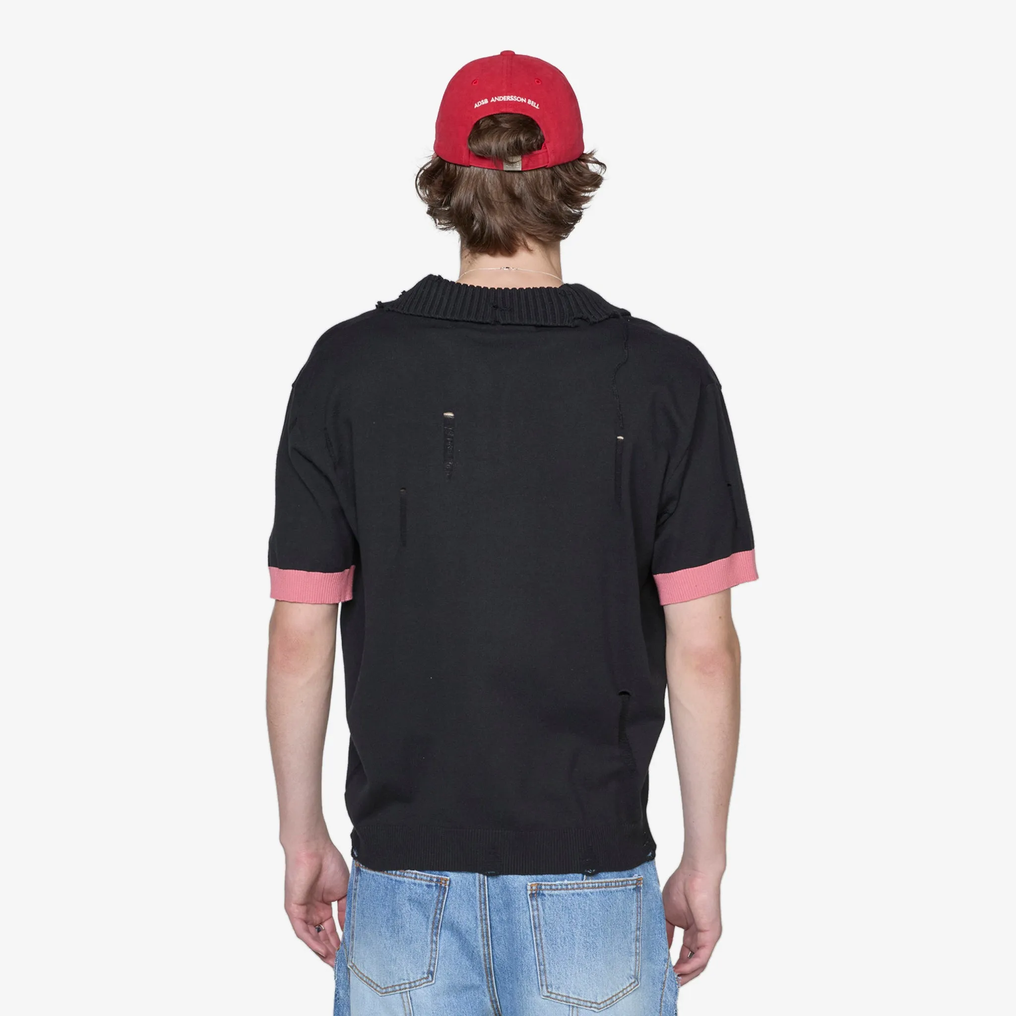 Damaged Polo Sweater Black | Pink